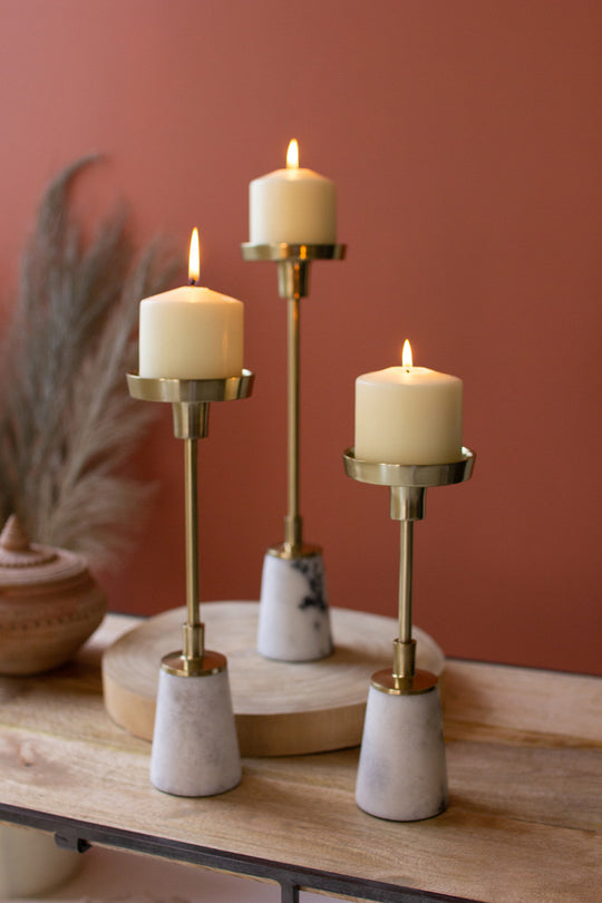 Brass pillar candle holders with marble bases