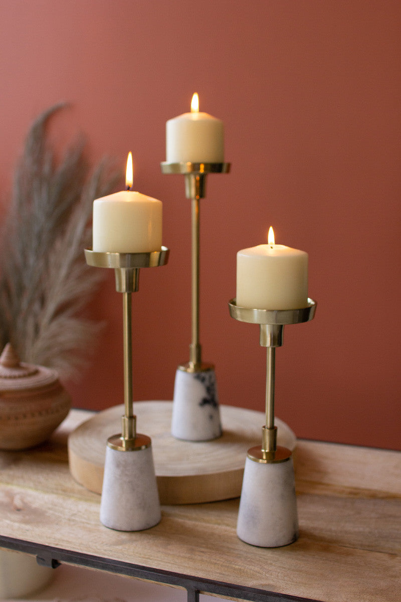 Brass pillar candle holders with marble bases