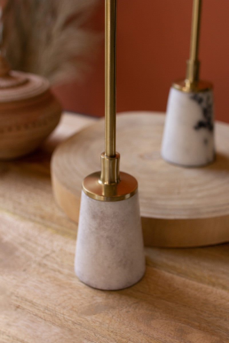 Brass pillar candle holders with marble bases